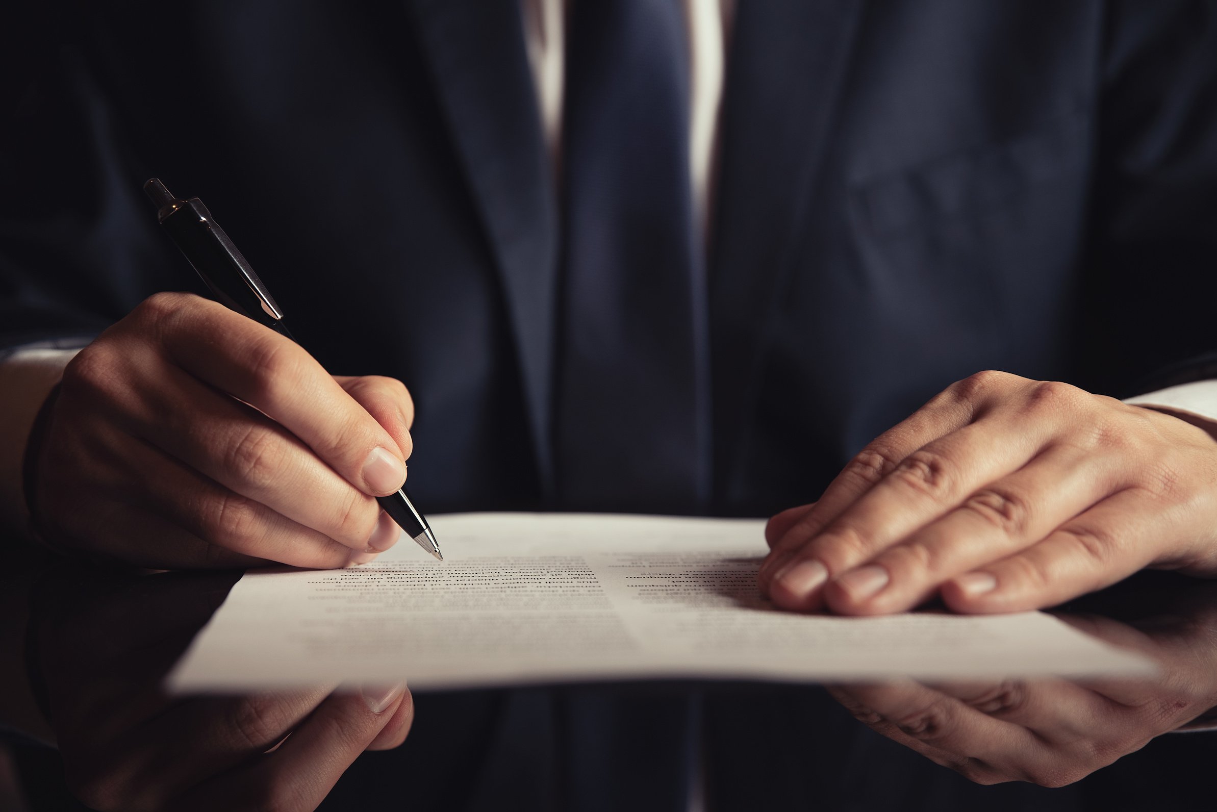 Lawyer, attorney signing a contract